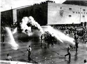 On what became known as “Hollywood Black Friday,” a six month strike by Hollywood set decorators turns into a bloody riot at the gates of Warner Brothers' studios