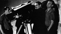 Alessandro Blasetti and cinematographer Václav Vich frame a shot on the set of 4 passi fra le nuvole