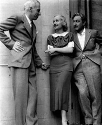 Director Howard Hawks, Carole Lombard and John Barrymore between scenes of Twentieth Century