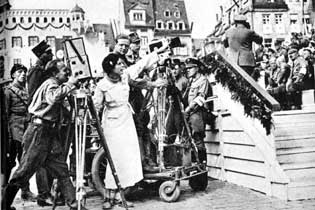 Leni Riefenstahl gives direction to her camera crew during filming of Triumph des Willens (1935)