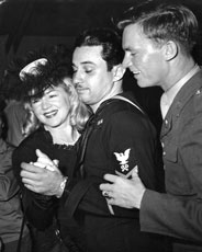 Claire Trevor dances with servicemen during the opening ceremonies of the Hollywood Canteen, October 1942