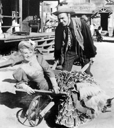Claire Trevor & Randolph Scott having fun in The Desperadoes (1943)