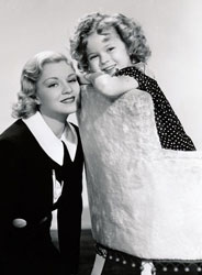 Before she was a 'tough broad' of 40s film noir, Claire Trevor displayed a softer side as Shirley Temple's mother in Baby Take a Bow (1934).
